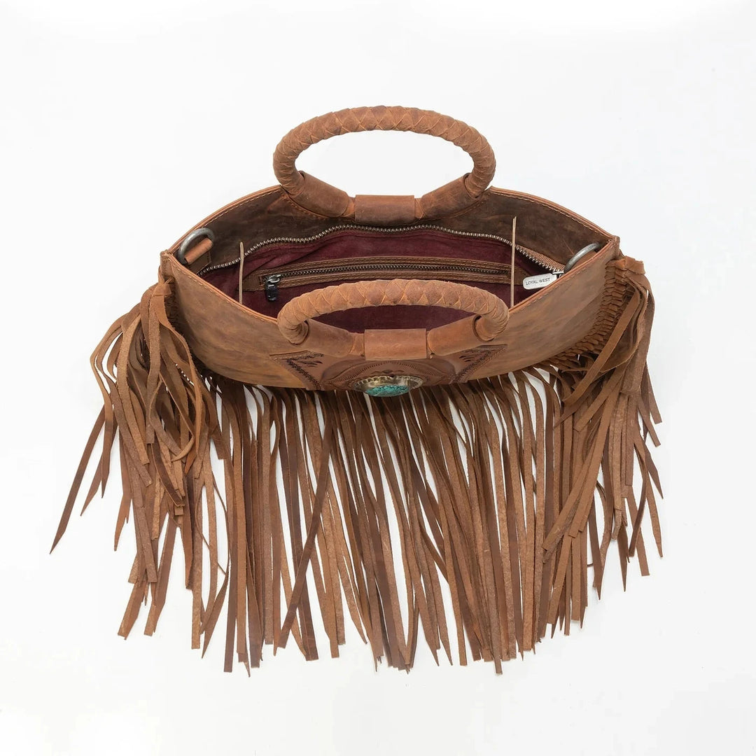 Brown leather handbag with fringe details on a white background