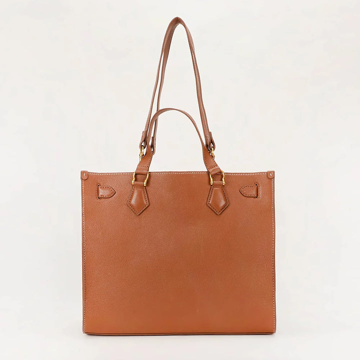 A structured tan leather tote bag with double shoulder straps and gold-tone hardware, photographed against a plain white background.