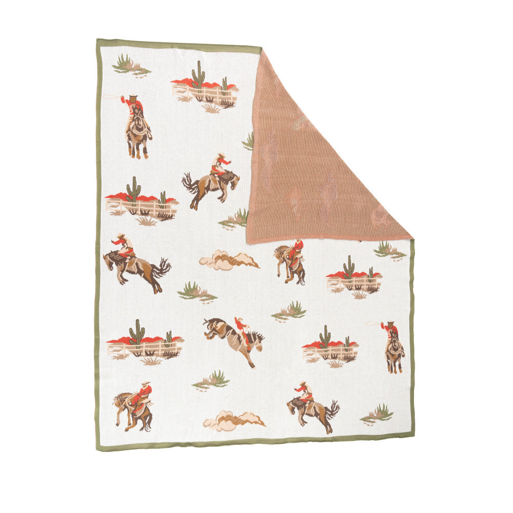 Blanket with cowboy pattern on a white background