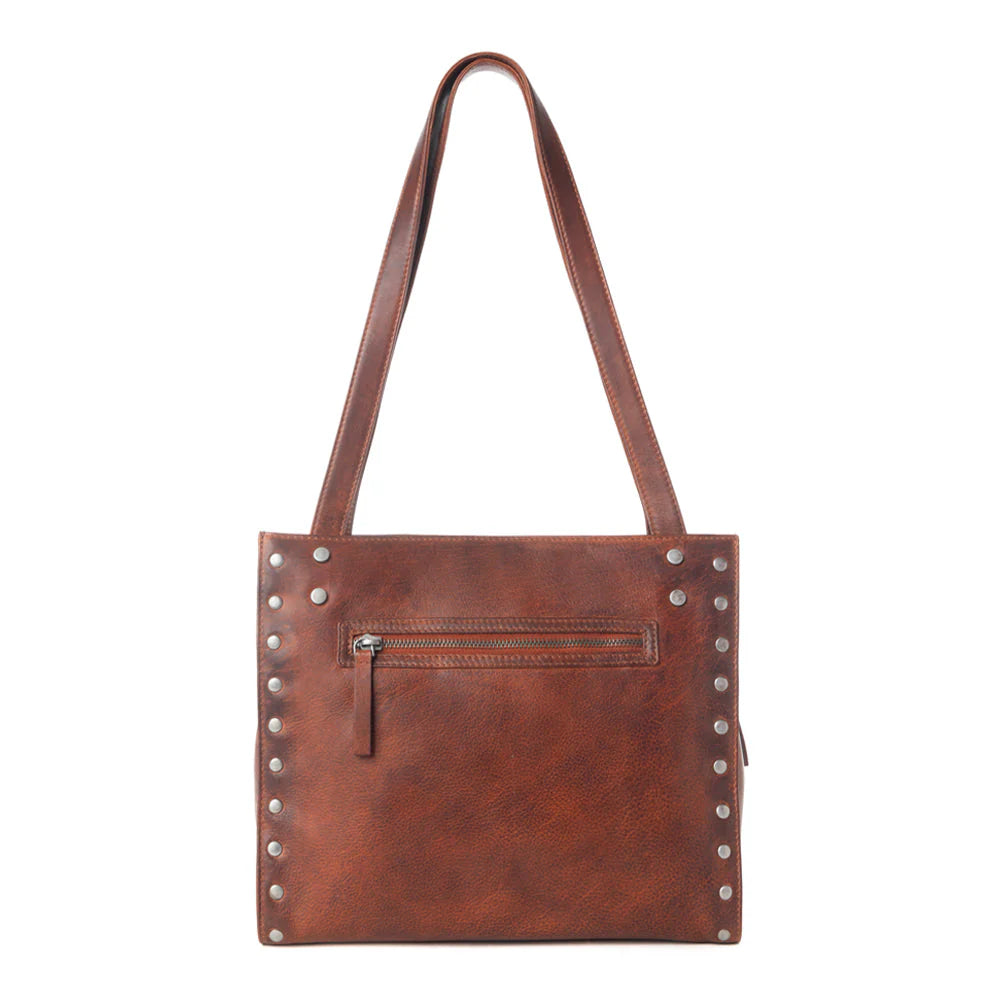 Brown leather tote bag with studs on a white background