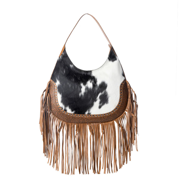 bag with cow print and brown fringe on a white background