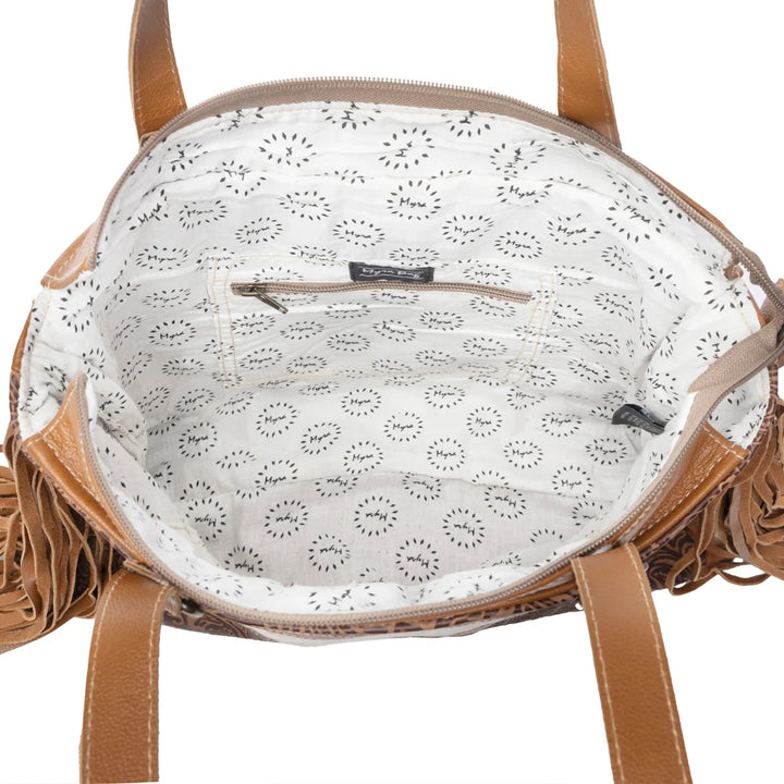 Brown leather handbag with a white interior featuring a subtle pattern on a white background