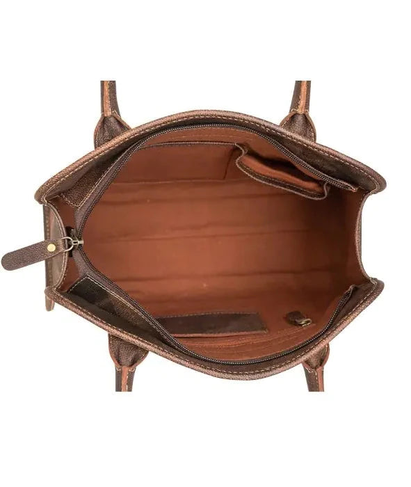 Top-down view of a brown leather handbag interior, showing the spacious compartment with a zippered main opening and side pockets, isolated on a white background.